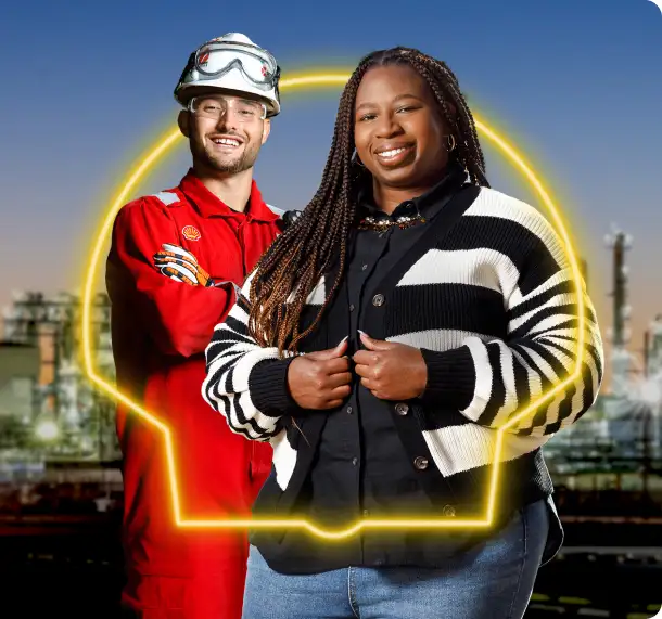 Two shell polymers employees standing next to eachother with pecten in background